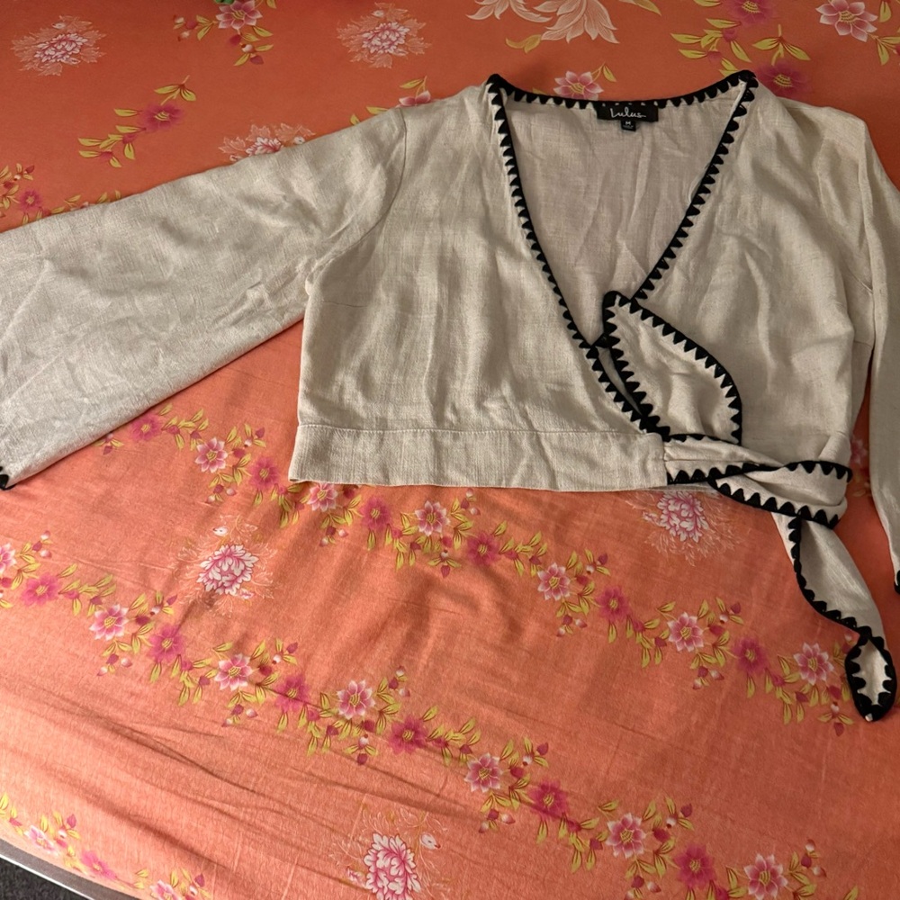 Lulu's Cream Wrap Blouse with Black Trim